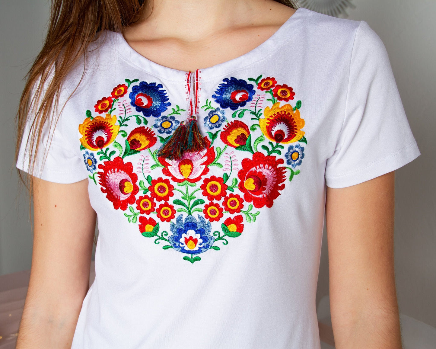 Sizes S-4XL. Heart Floral Embroidered T-Shirt – White Boho Tee with Ukrainian & Mexican Folk Stitch, Botanical Embroidery & Colorful Tassel Accent